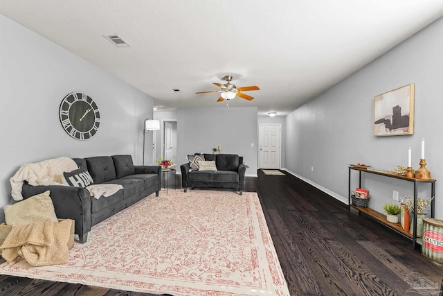 living room with dark hardwood / wood-style floors and ceiling fan