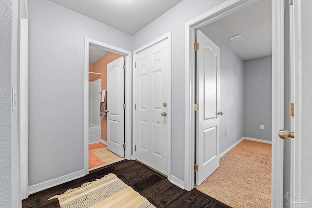 hallway featuring dark hardwood / wood-style floors