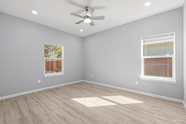 unfurnished room with recessed lighting, a ceiling fan, light wood-style floors, and baseboards