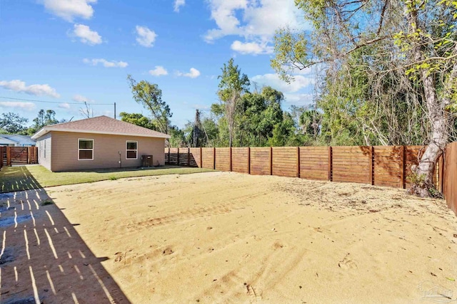 view of yard with a fenced backyard