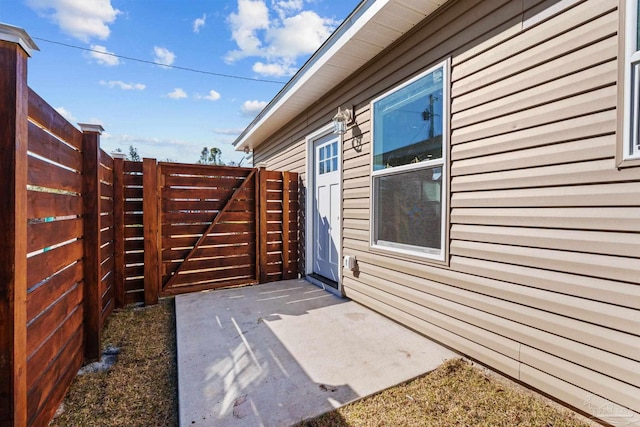 exterior space featuring a patio area and fence