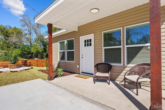 view of patio / terrace featuring fence