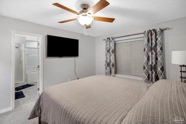 carpeted bedroom featuring ceiling fan and ensuite bathroom