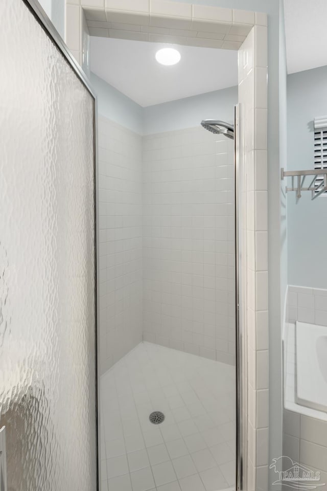 bathroom featuring an enclosed shower