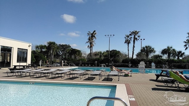 view of swimming pool with a patio