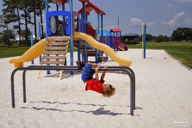 view of jungle gym with a lawn