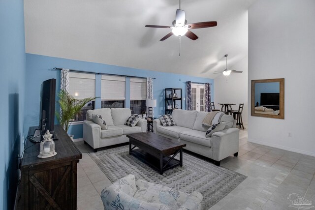 interior space with high vaulted ceiling, sink, ceiling fan, and light hardwood / wood-style flooring