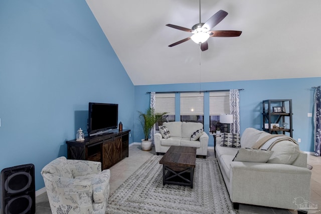 living room featuring ceiling fan, light tile patterned floors, and high vaulted ceiling