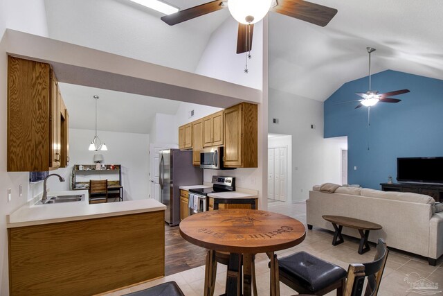 living room featuring ceiling fan, light tile patterned floors, and high vaulted ceiling