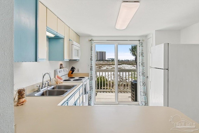 1440 Paradise Point Dr Unit 13, Navarre Beach, FL 32566 - kitchen with white appliances and light countertops