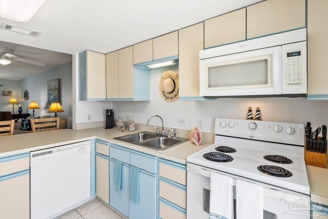 1440 Paradise Point Dr Unit 13, Navarre Beach, FL 32566 - kitchen with white appliances, light countertops, ceiling fan, cream cabinets, and light tile patterned floors
