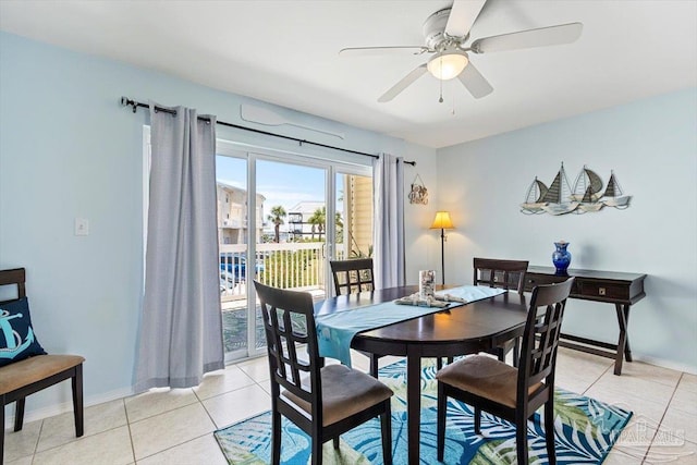1440 Paradise Point Dr Unit 13, Navarre Beach, FL 32566 - dining room with light tile patterned floors and a ceiling fan