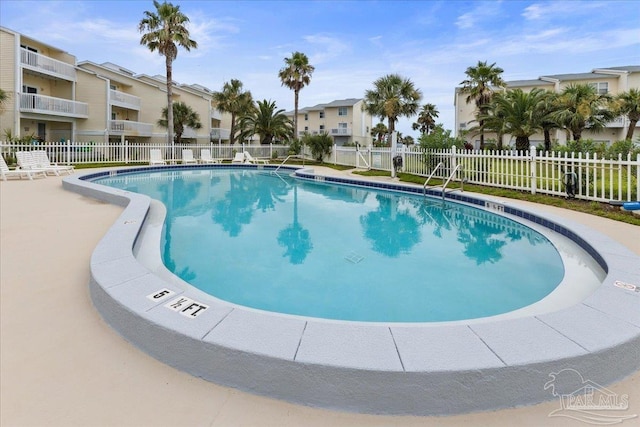 1440 Paradise Point Dr Unit 13, Navarre Beach, FL 32566 - community pool with a residential view
