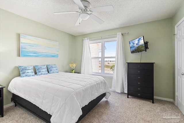 1440 Paradise Point Dr Unit 13, Navarre Beach, FL 32566 - bedroom featuring light colored carpet, a textured ceiling, and ceiling fan