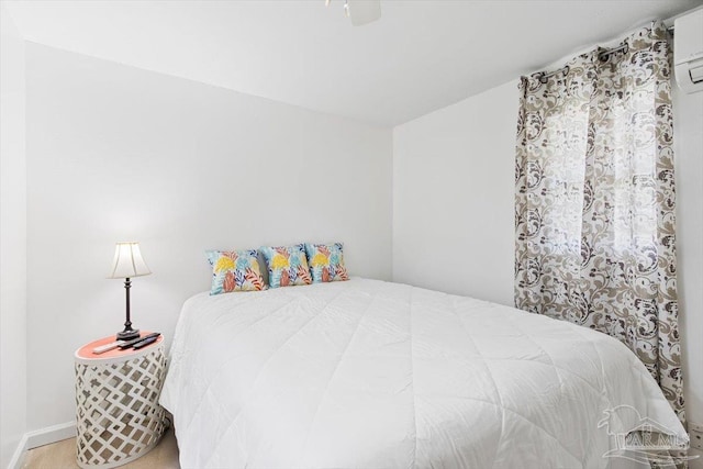 1440 Paradise Point Dr Unit 13, Navarre Beach, FL 32566 - bedroom with ceiling fan and an AC wall unit