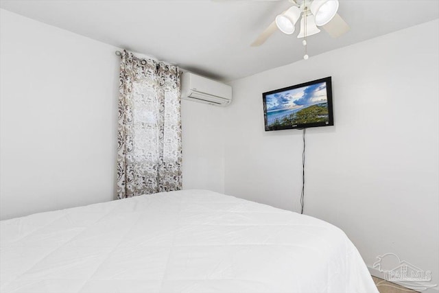 1440 Paradise Point Dr Unit 13, Navarre Beach, FL 32566 - bedroom featuring a wall unit AC and ceiling fan