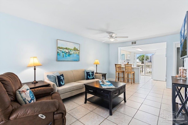 1440 Paradise Point Dr Unit 13, Navarre Beach, FL 32566 - living area with ceiling fan and light tile patterned floors