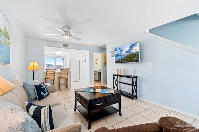 1440 Paradise Point Dr Unit 13, Navarre Beach, FL 32566 - living room with ceiling fan and light tile patterned flooring