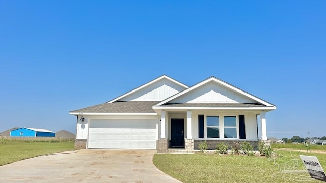 craftsman-style house featuring a garage and a front yard