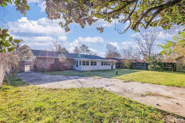 exterior space with a yard and fence