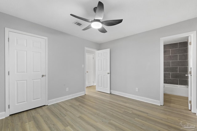 unfurnished bedroom with ceiling fan, visible vents, baseboards, and light wood-style flooring