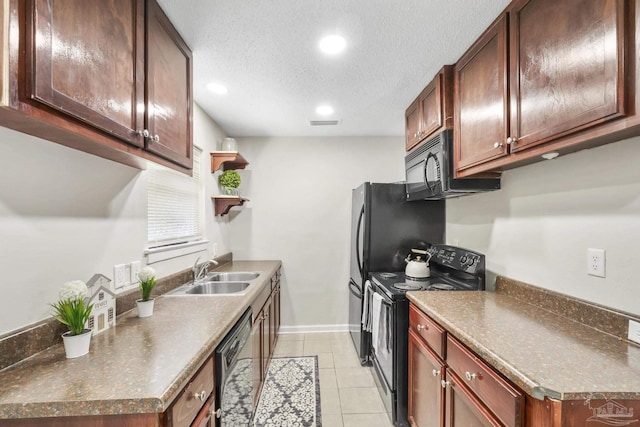 kitchen with sink, light tile patterned flooring, black appliances, and a textured ceiling