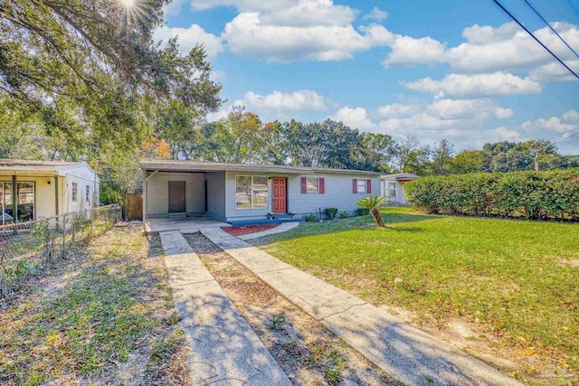 ranch-style home with a carport and a front yard