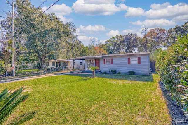 ranch-style house with a front lawn