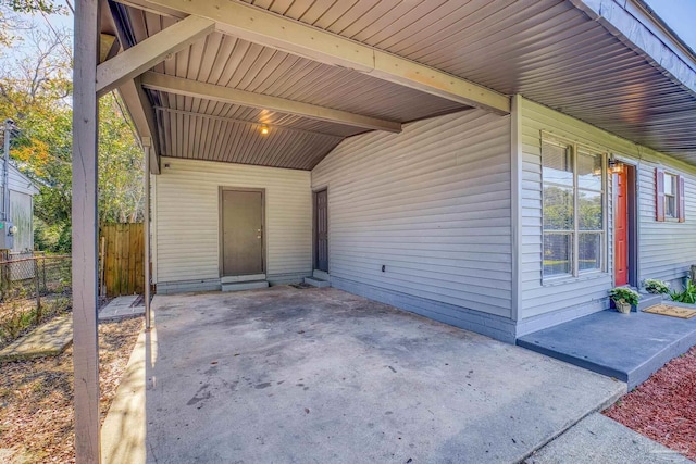 exterior space with a carport