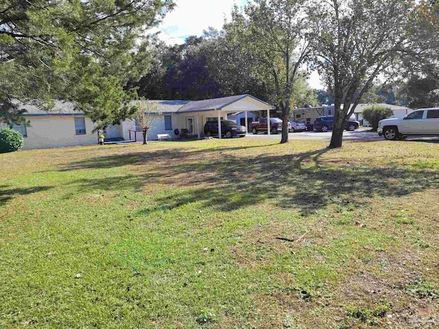 view of yard with a carport