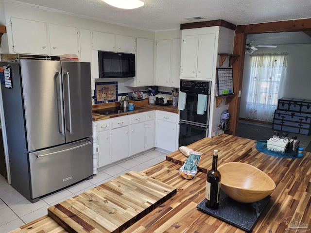 kitchen featuring white cabinetry, ceiling fan, a textured ceiling, light tile patterned floors, and black appliances