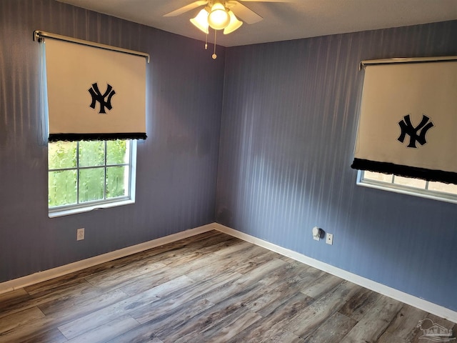 spare room featuring ceiling fan and wood-type flooring