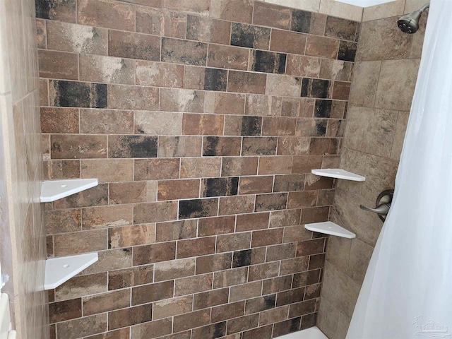 bathroom featuring curtained shower