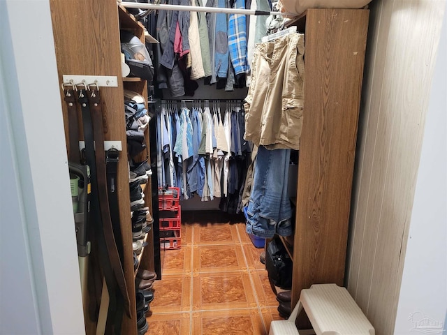 walk in closet with tile patterned flooring