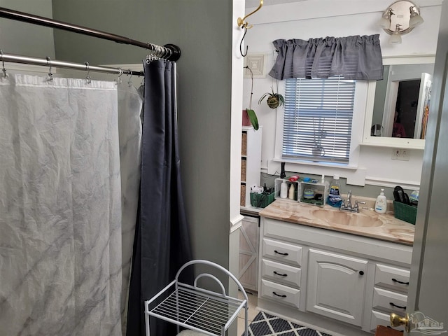 bathroom with vanity and curtained shower