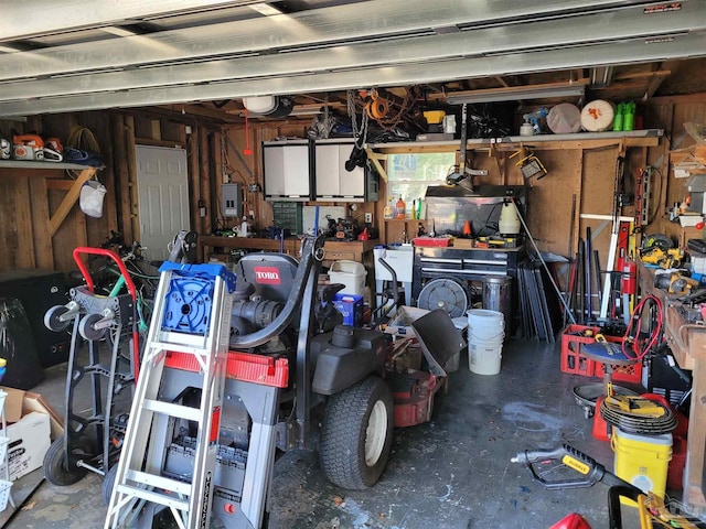 garage featuring a workshop area and electric panel