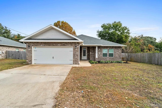 view of front facade with a garage and a front yard