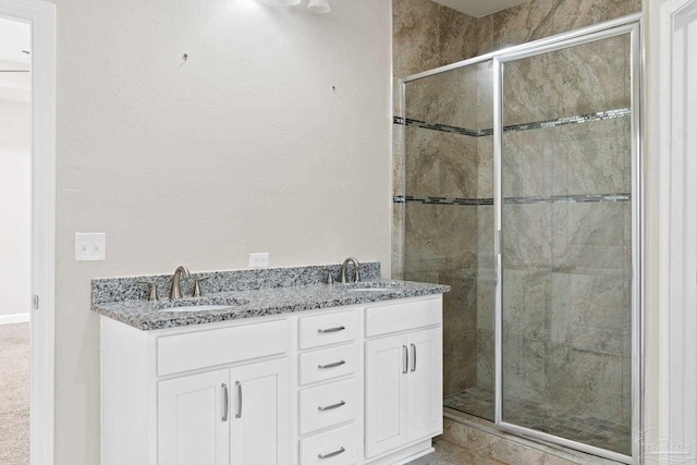 bathroom with vanity and walk in shower