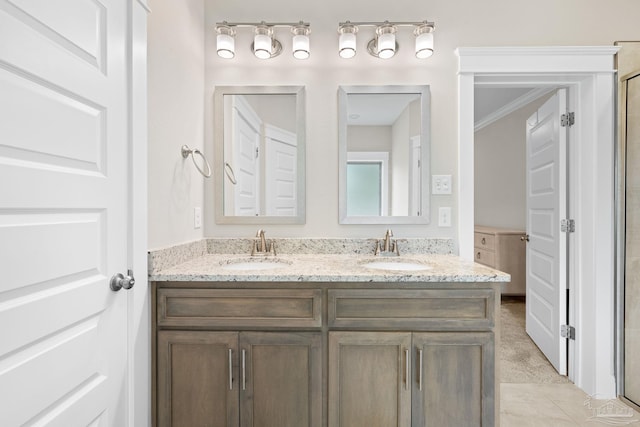 1604 Cadence Loop, Cantonment, FL 32533 - bathroom with double vanity, crown molding, and an enclosed shower