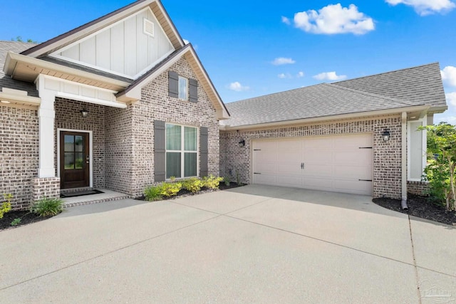 1604 Cadence Loop, Cantonment, FL 32533 - view of front of property with brick siding, board and batten siding, driveway, and a shingled roof