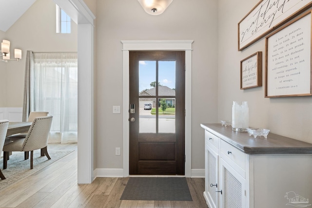 1604 Cadence Loop, Cantonment, FL 32533 - foyer entrance featuring light wood-type flooring, plenty of natural light, and baseboards
