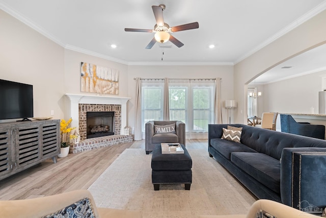 1604 Cadence Loop, Cantonment, FL 32533 - living area featuring wood finished floors, a ceiling fan, arched walkways, ornamental molding, and recessed lighting