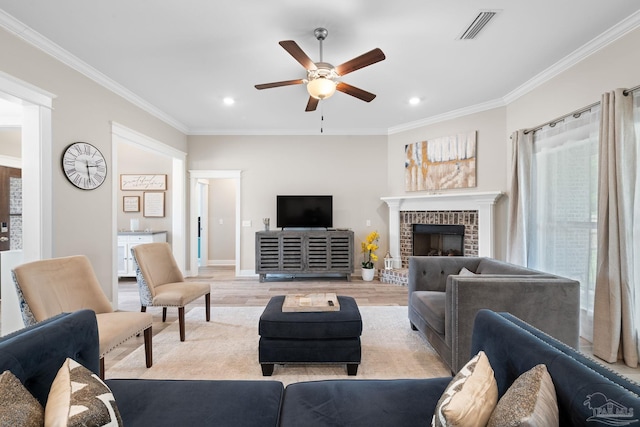 1604 Cadence Loop, Cantonment, FL 32533 - living area featuring ceiling fan, crown molding, light wood finished floors, a brick fireplace, and recessed lighting