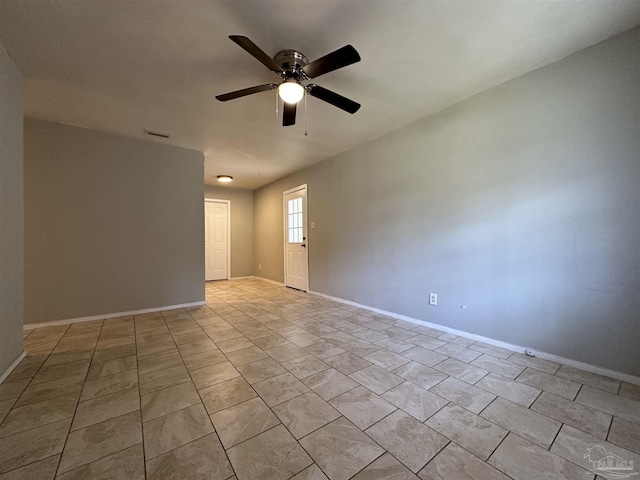 tiled empty room with ceiling fan