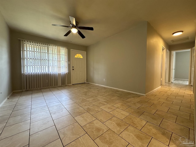 entryway featuring light tile patterned flooring and ceiling fan