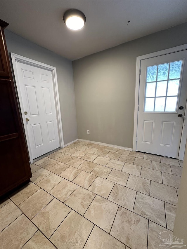 interior space featuring light tile patterned flooring