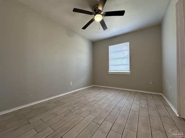 unfurnished room featuring ceiling fan and light wood-type flooring