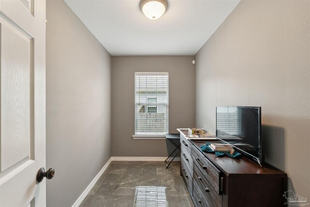 2188 Janet St, Navarre, FL 32566 - home office featuring baseboards and dark marble finish floors