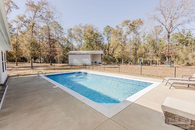 view of pool featuring a patio