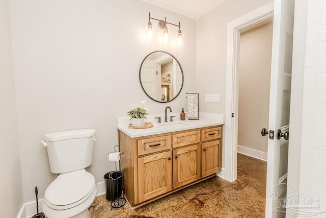 bathroom with vanity and toilet